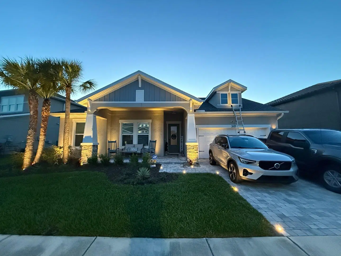 A front view of a Wesley Chapel home with natural evening light and soft accents.